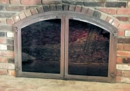 Nantucket Arch All  natural iron vice bi fold doors, standard smoked glass
